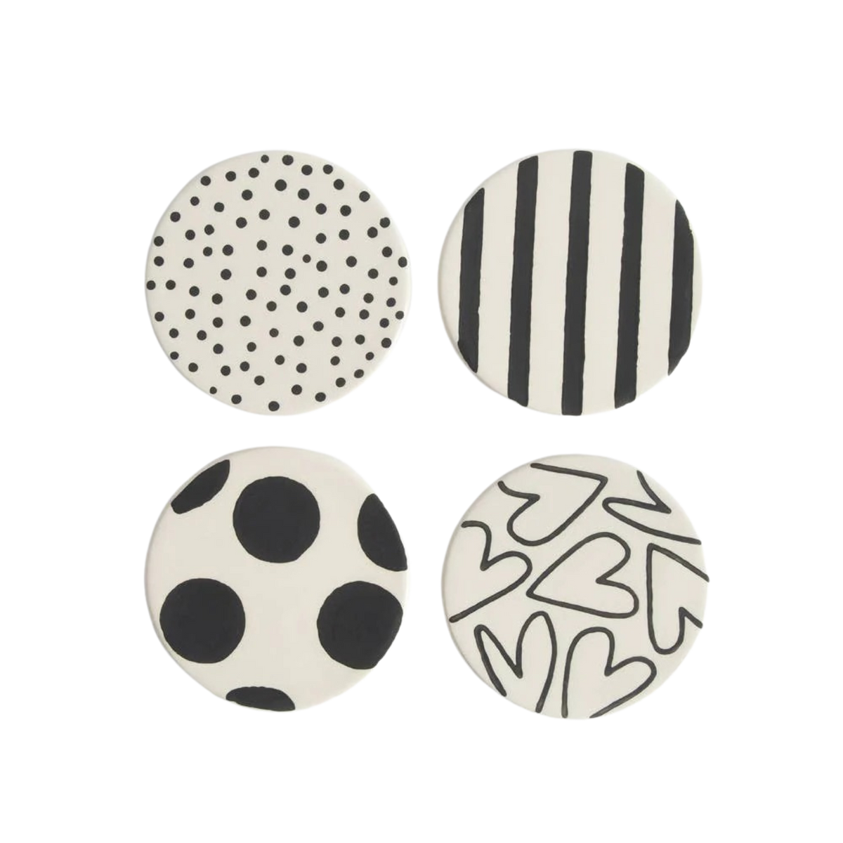 Four round coasters with black and white patterns on a white background