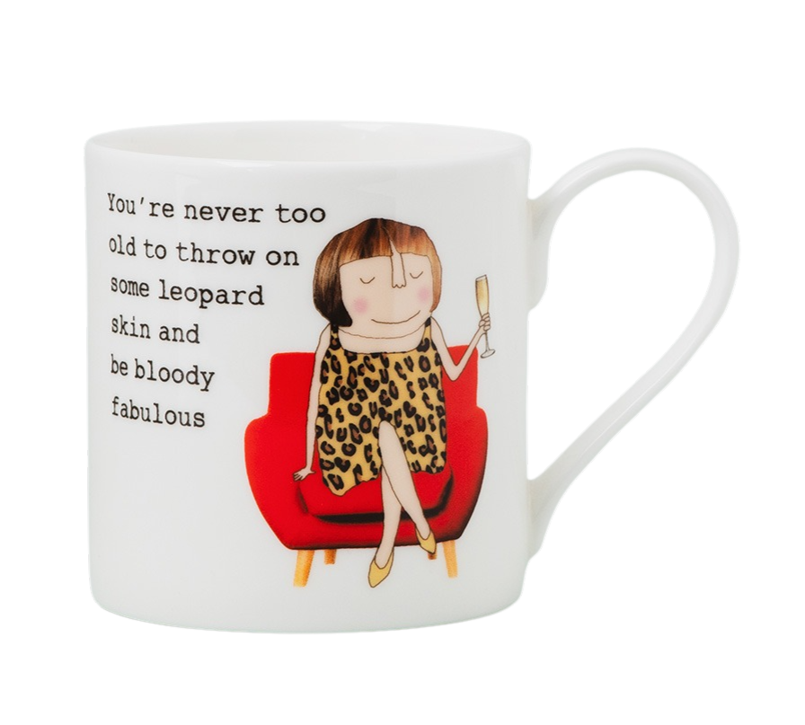 Mug with illustration of woman wearing leopard print dress with a glass of bubbly alongside text "You're never too old to throw on some leopard skin and be bloody fabulous".